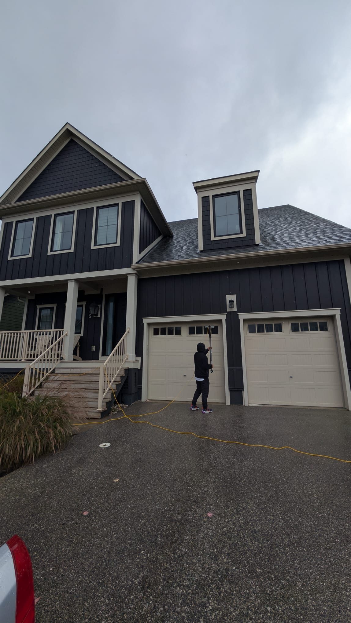 Ontario Window Cleaning crew cleaning windows at a Hamilton home — streak-free, purified-water system.