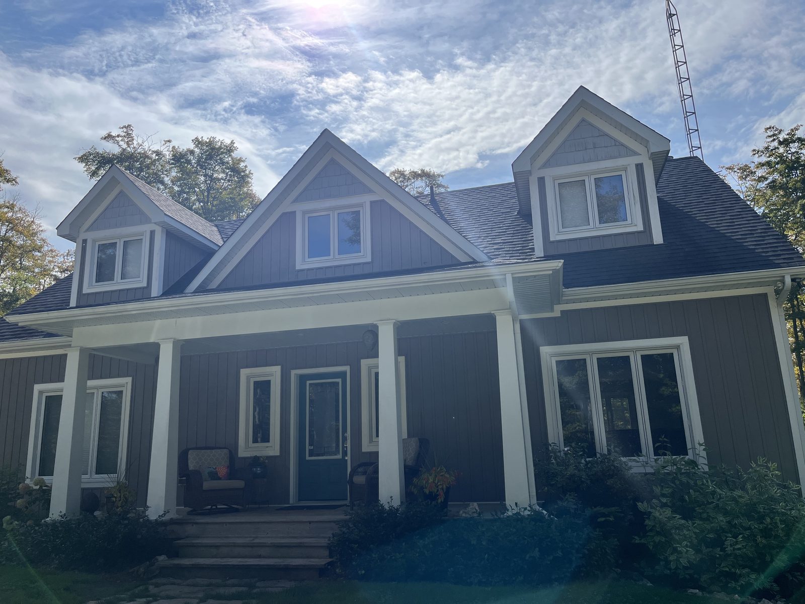 Ontario Window Cleaning crew cleaning windows at a Richmond Hill home — streak-free, purified-water system.